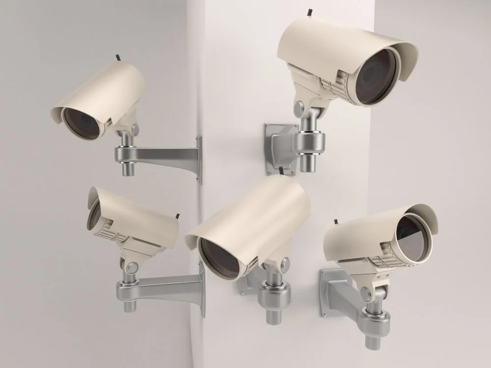 Security cameras mounted on a wall